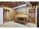 Unfinished basement with a workbench and pegboard, offering a functional space at 5065 Hickory Hills Dr, Woodstock, GA 30188