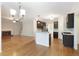 Open-concept kitchen featuring granite countertops, stainless steel appliances, and hardwood floors at 5065 Hickory Hills Dr, Woodstock, GA 30188