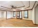 Living room featuring hardwood floors, a ceiling fan and a door that leads to the outside at 5065 Hickory Hills Dr, Woodstock, GA 30188