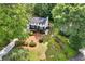 Aerial view of a charming two-story home with mature landscaping and a well manicured lawn at 529 Greystone Trl, Marietta, GA 30068