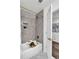 Bathroom features a shower/tub combo with gray subway tile and stylish hexagon floor at 529 Greystone Trl, Marietta, GA 30068
