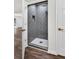 Bathroom features gray tile shower and wood floors at 529 Greystone Trl, Marietta, GA 30068