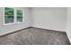 Bright bedroom features fresh paint, plush carpeting and a large window at 529 Greystone Trl, Marietta, GA 30068