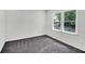 Bedroom featuring two bright windows, modern paint and plush carpeting at 529 Greystone Trl, Marietta, GA 30068