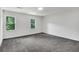 This bedroom has new carpet, two windows and a fresh coat of paint at 529 Greystone Trl, Marietta, GA 30068
