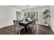 Bright dining room featuring hardwood floors, a modern chandelier, and a large bay window at 529 Greystone Trl, Marietta, GA 30068