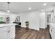 Modern kitchen featuring white cabinets, stainless steel appliances, and a center island with bar seating at 529 Greystone Trl, Marietta, GA 30068