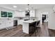 Modern kitchen featuring white cabinets, stainless steel appliances, and a center island with bar seating at 529 Greystone Trl, Marietta, GA 30068