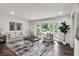 Bright living room featuring a large bay window, hardwood floors, and neutral decor at 529 Greystone Trl, Marietta, GA 30068