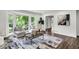 Bright living room featuring a large bay window, hardwood floors, and neutral decor at 529 Greystone Trl, Marietta, GA 30068