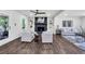 Spacious living room featuring a brick fireplace, custom built-ins, and hardwood flooring at 529 Greystone Trl, Marietta, GA 30068