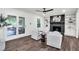Spacious living room featuring a brick fireplace, custom built-ins, and hardwood flooring at 529 Greystone Trl, Marietta, GA 30068