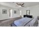 Serene main bedroom featuring plush carpet, large windows, and neutral color palette at 529 Greystone Trl, Marietta, GA 30068