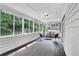 Relaxing sunroom with ample windows providing natural light and views of the backyard at 529 Greystone Trl, Marietta, GA 30068