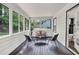 Relaxing sunroom with ample windows providing natural light and views of the backyard at 529 Greystone Trl, Marietta, GA 30068