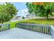 Backyard view from the deck with green grass and a white fence at 855 Madison Chase Way, Lawrenceville, GA 30045