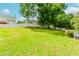 Generous backyard space with lush green grass, perfect for outdoor activities and entertaining at 855 Madison Chase Way, Lawrenceville, GA 30045