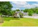 Expansive lawn in the backyard, enclosed with a white picket fence for privacy and security at 855 Madison Chase Way, Lawrenceville, GA 30045
