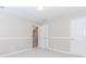 Neutral bedroom with gray walls, white trim, and three doors at 855 Madison Chase Way, Lawrenceville, GA 30045