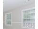 Bright bedroom features gray walls, white trim, and large windows at 855 Madison Chase Way, Lawrenceville, GA 30045