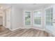 Charming breakfast nook with large windows providing plenty of natural light and views of the backyard at 855 Madison Chase Way, Lawrenceville, GA 30045