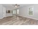 Spacious living room boasts wood-look floors and large windows for lots of natural light at 855 Madison Chase Way, Lawrenceville, GA 30045