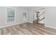 Bright living room features new flooring, fresh paint, and natural light from large windows at 855 Madison Chase Way, Lawrenceville, GA 30045