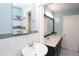 This renovated bathroom has double sinks, a large mirror, and a shower with a glass door at 175 Brookhaven Dr, Marietta, GA 30066