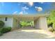 Spacious carport featuring ample parking space and exterior lighting at 175 Brookhaven Dr, Marietta, GA 30066