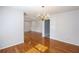 Bright dining area featuring hardwood floors, a chandelier, and a view into an adjacent room at 175 Brookhaven Dr, Marietta, GA 30066
