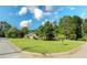 Charming single-story home with lush green lawn and mature trees on a sunny day at 175 Brookhaven Dr, Marietta, GA 30066