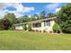 A charming home with well-manicured front yard, and lush green lawn and garden at 175 Brookhaven Dr, Marietta, GA 30066