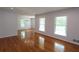 Open living room boasts gleaming hardwood floors and recessed lighting at 175 Brookhaven Dr, Marietta, GA 30066