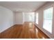 Bright living room with hardwood floors and windows with blinds, offering natural light and privacy at 175 Brookhaven Dr, Marietta, GA 30066