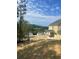 The back yard features new sod and a view of neighboring houses in the distance at 222 Silvercrest Dr, Acworth, GA 30101