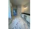 Bathroom showing glass shower, vanity, commode and marble-look tile flooring throughout at 222 Silvercrest Dr, Acworth, GA 30101