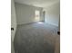 Spacious bedroom with neutral carpet and plenty of natural light from the windows at 222 Silvercrest Dr, Acworth, GA 30101