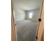 Empty bedroom with carpeted floors and neutral-colored walls with natural light from a window at 222 Silvercrest Dr, Acworth, GA 30101