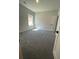 Bright bedroom with plush carpeting, window and paneled door at 222 Silvercrest Dr, Acworth, GA 30101
