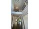 Bright, open entryway with hardwood floors and views into adjoining rooms and a wrought iron staircase at 222 Silvercrest Dr, Acworth, GA 30101