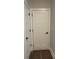 Hallway with view of closed doors and wood floors at 222 Silvercrest Dr, Acworth, GA 30101
