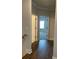 Hallway with hardwood flooring, with access to another bedroom and bathroom at 222 Silvercrest Dr, Acworth, GA 30101
