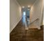 Hallway with beautiful dark wood-look floors leading up to the second floor at 222 Silvercrest Dr, Acworth, GA 30101