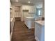 White kitchen with stainless appliances, island and pantry area at 222 Silvercrest Dr, Acworth, GA 30101