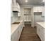 Well-lit kitchen featuring modern cabinetry, quartz countertops, and a convenient mudroom area at 222 Silvercrest Dr, Acworth, GA 30101