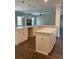 Spacious kitchen with white cabinetry, large island, and hardwood floors at 222 Silvercrest Dr, Acworth, GA 30101