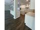 Open concept kitchen with white cabinets, double islands and hardwood floors at 222 Silvercrest Dr, Acworth, GA 30101