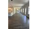 This is a spacious room with dark hardwood floors, white walls and trim, and recessed lighting at 222 Silvercrest Dr, Acworth, GA 30101