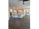 Open layout featuring a kitchen island, white cabinetry, and an electric fireplace in the living room at 222 Silvercrest Dr, Acworth, GA 30101