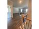 Stairway and landing open to an airy living room with lots of natural light at 222 Silvercrest Dr, Acworth, GA 30101